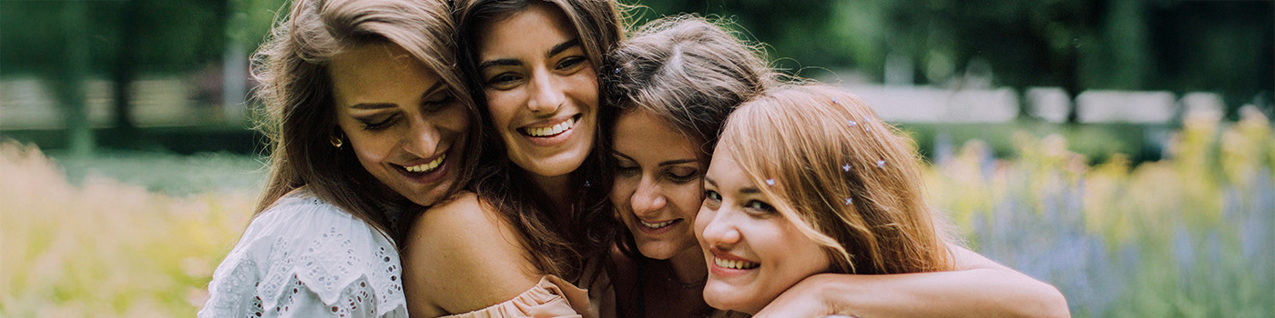 Friends embrace and laugh—the warmth of circle